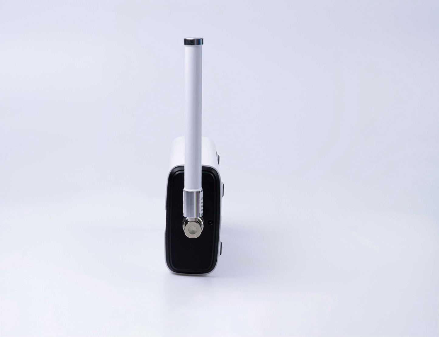 Milesight UG65 LoRaWAN gateway with external antenna, end view.