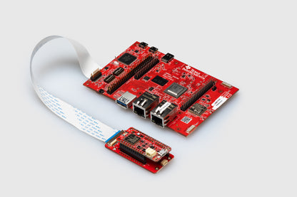 MCCI Model 4922 test controller connected to a TI SK-AM64 development board via flex cable.